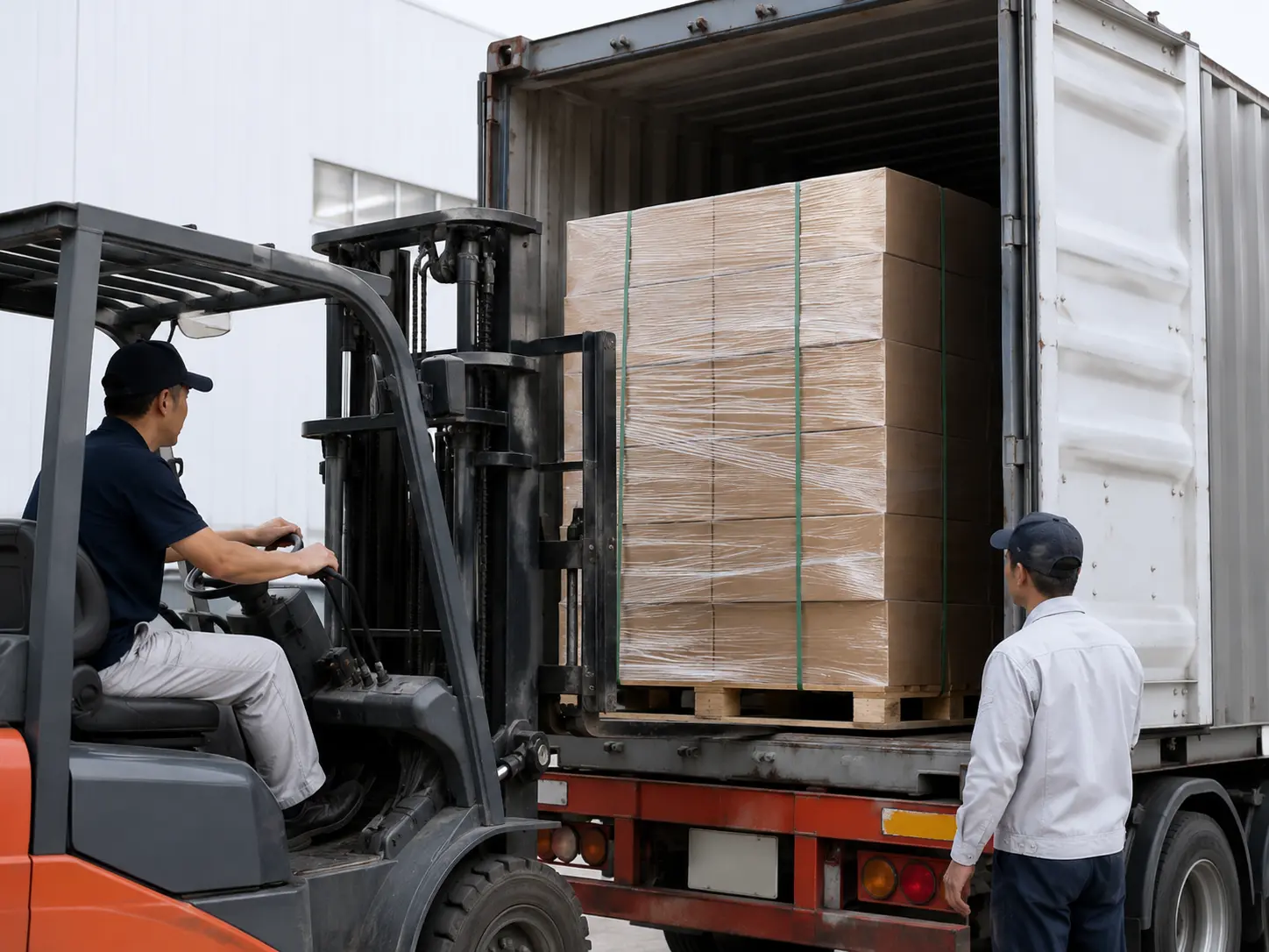 Forklift loading export-ready cartons for international apparel packaging delivery.