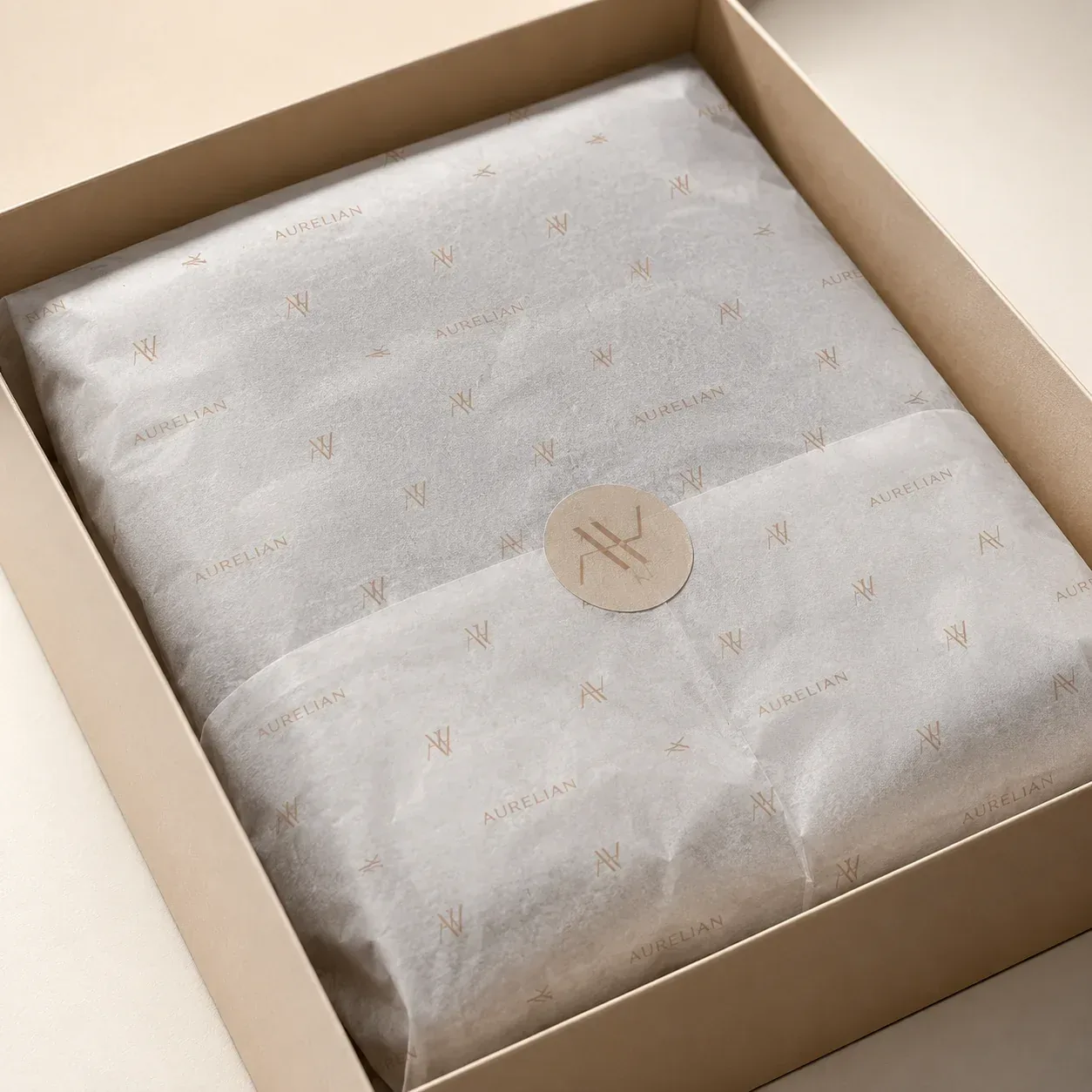 Branded tissue wrap on apparel packaging.