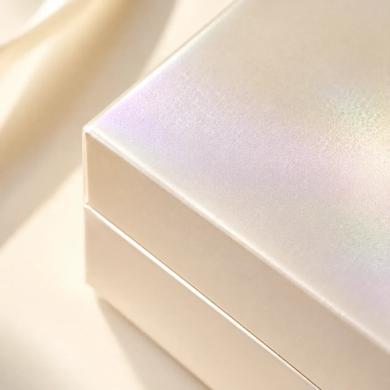 Pearlescent coating on cosmetics packaging.