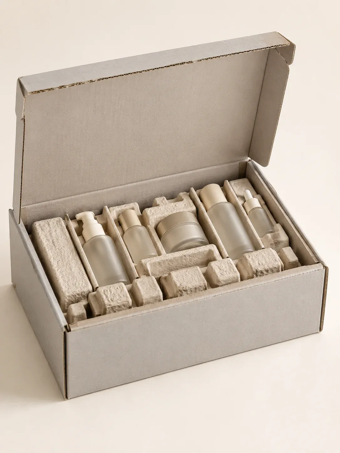 Cosmetics packaging fulfillment with corrugated boxes molded trays and beauty products.