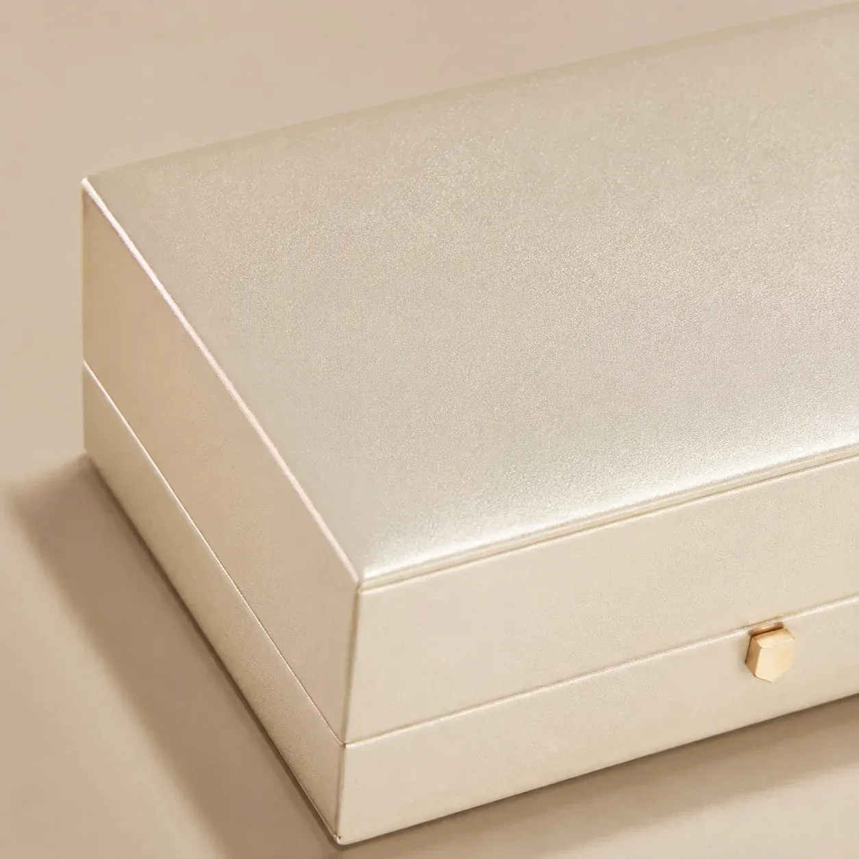 Pearlescent coating on jewelry packaging.